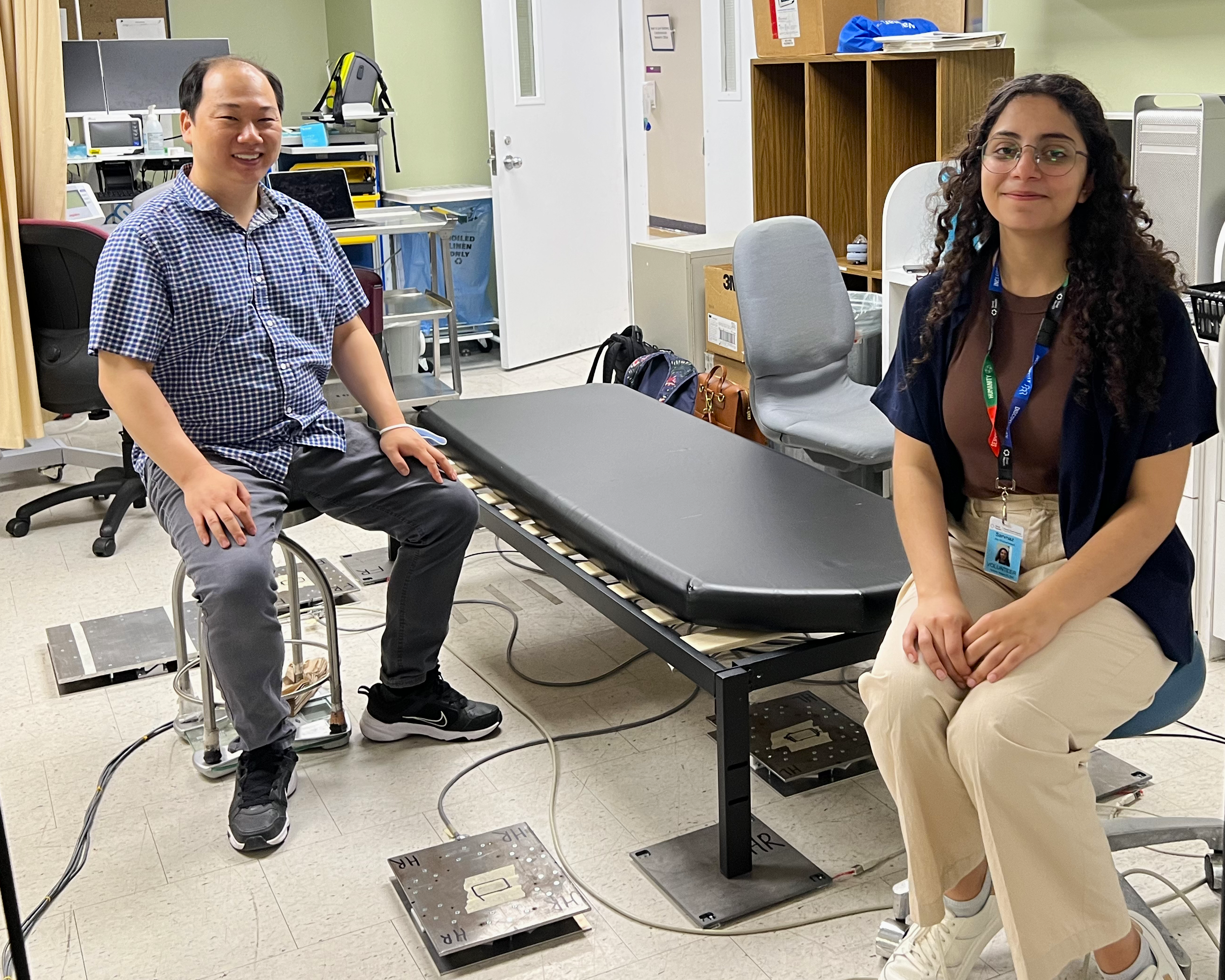 Isaac Chang and summer student Sarvnaz Ale Mohammad demonstrate how the remote monitoring technology Smart Tile works.