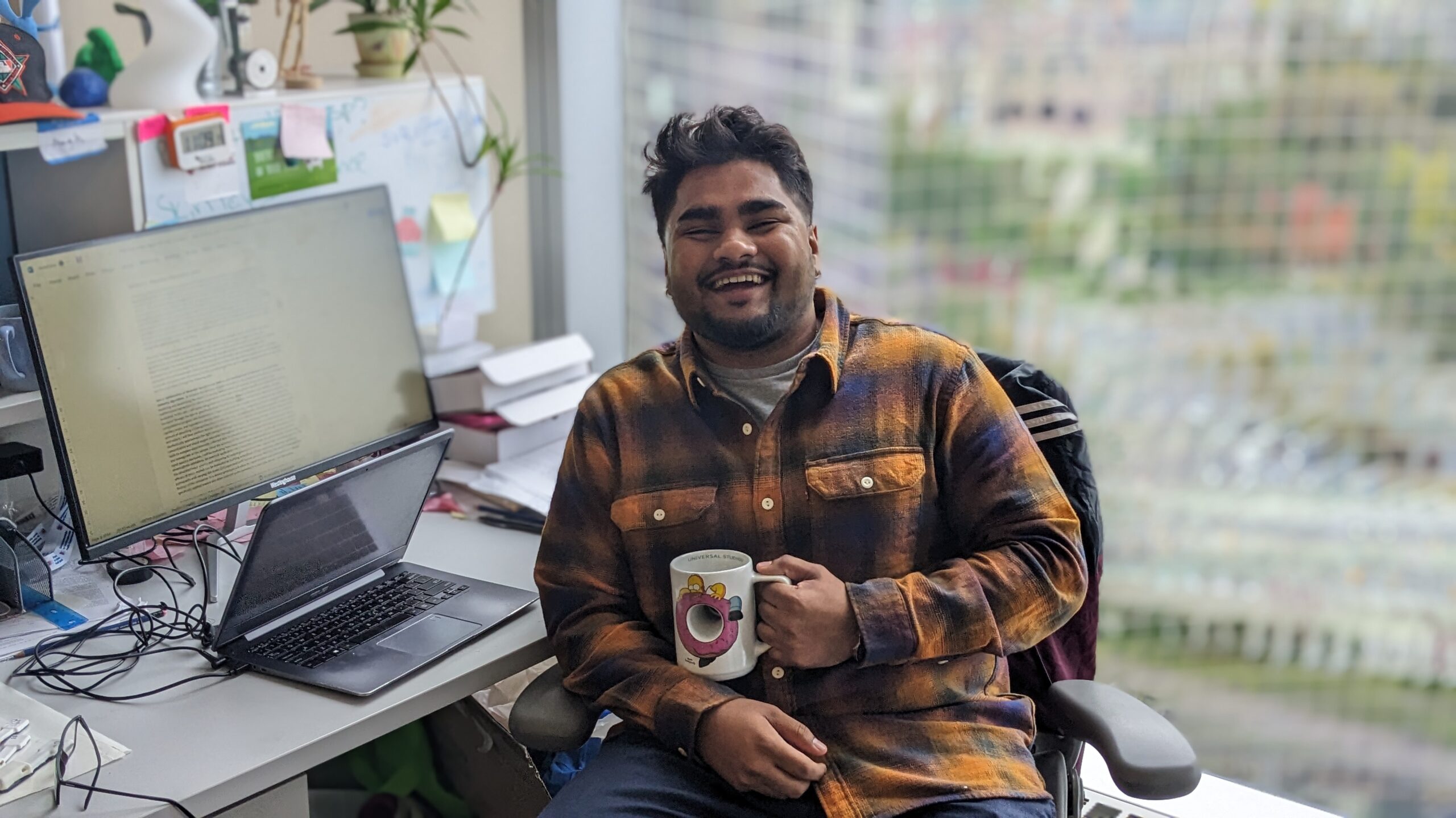 Megh Rathod, UofT Biomedical Engineering grad student, at his desk.