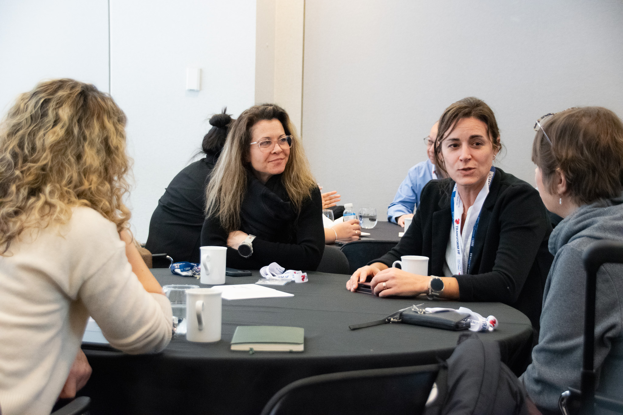 Participants from the Foundations course seated at a roundtable.
